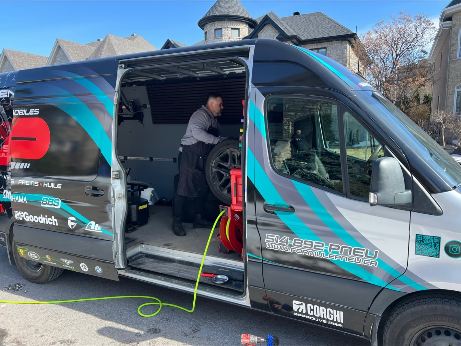 Van doors open during an on-site tire appointment